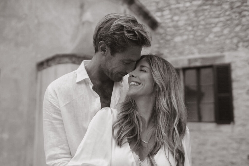 Couple sharing an intimate moment during a Mallorca engagement session