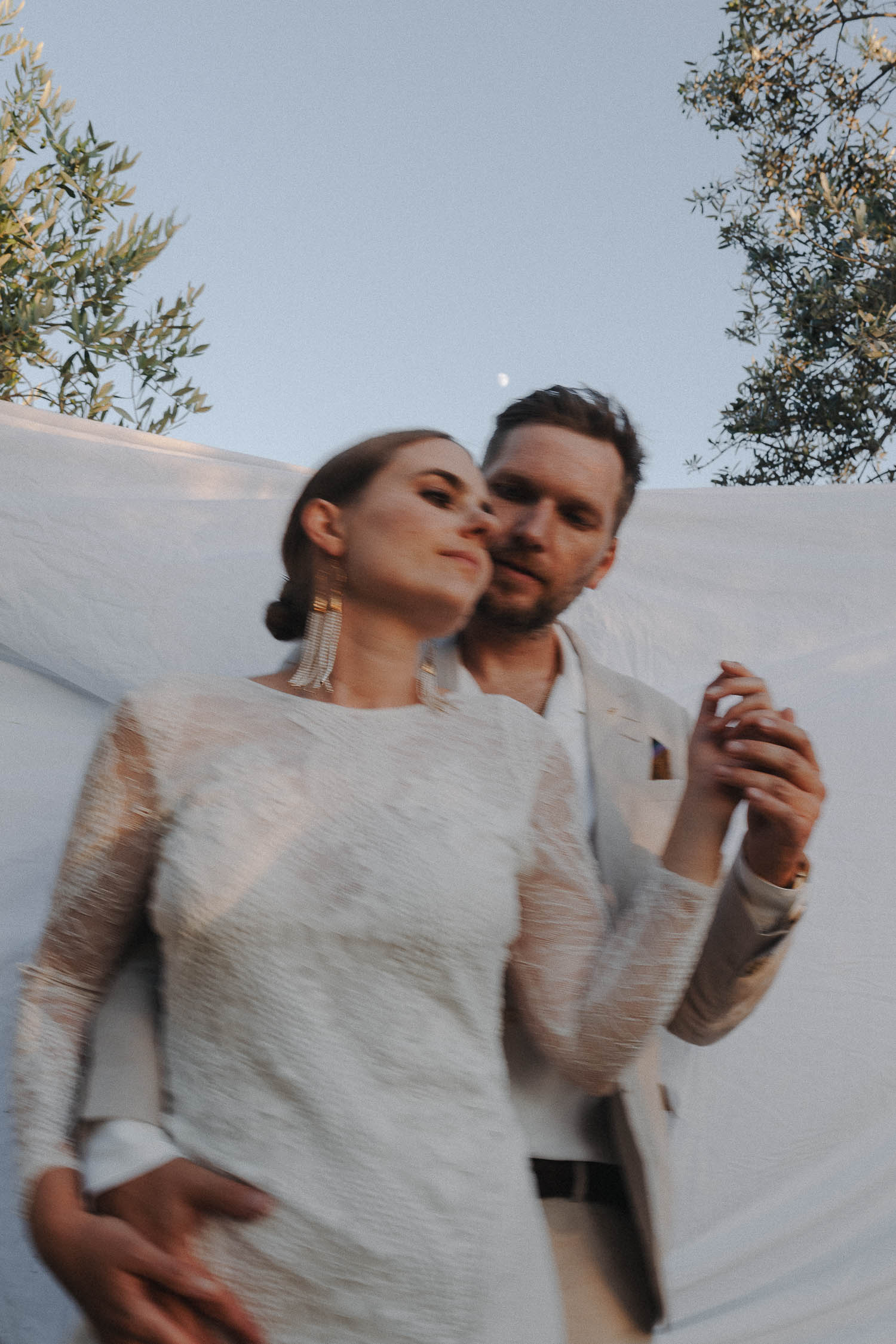 bride and groom share an intimate moment in the mediterranean region.