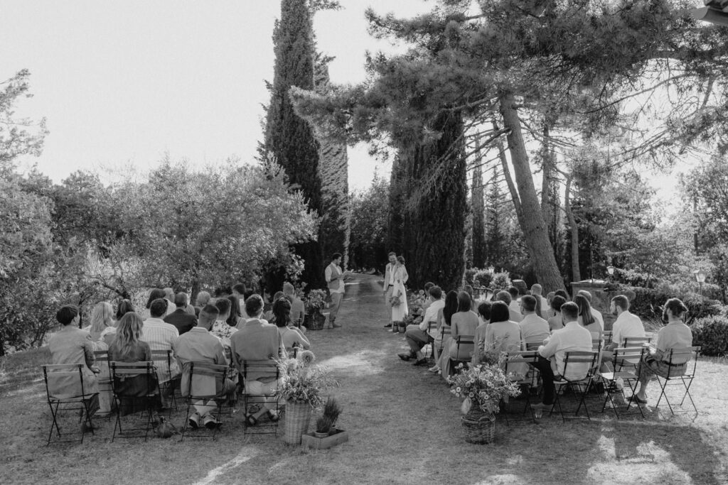 Outdoor wedding ceremony in a Tuscan garden.